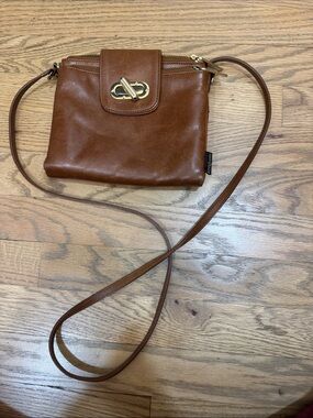 Russell & Bromley Brown Leather Crossbody Bag with Turn-Lock Closure